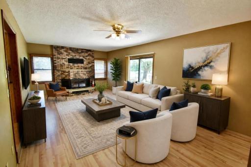 Bright and Inviting Living Room with an abundance or natural light and a wood fireplace!!!