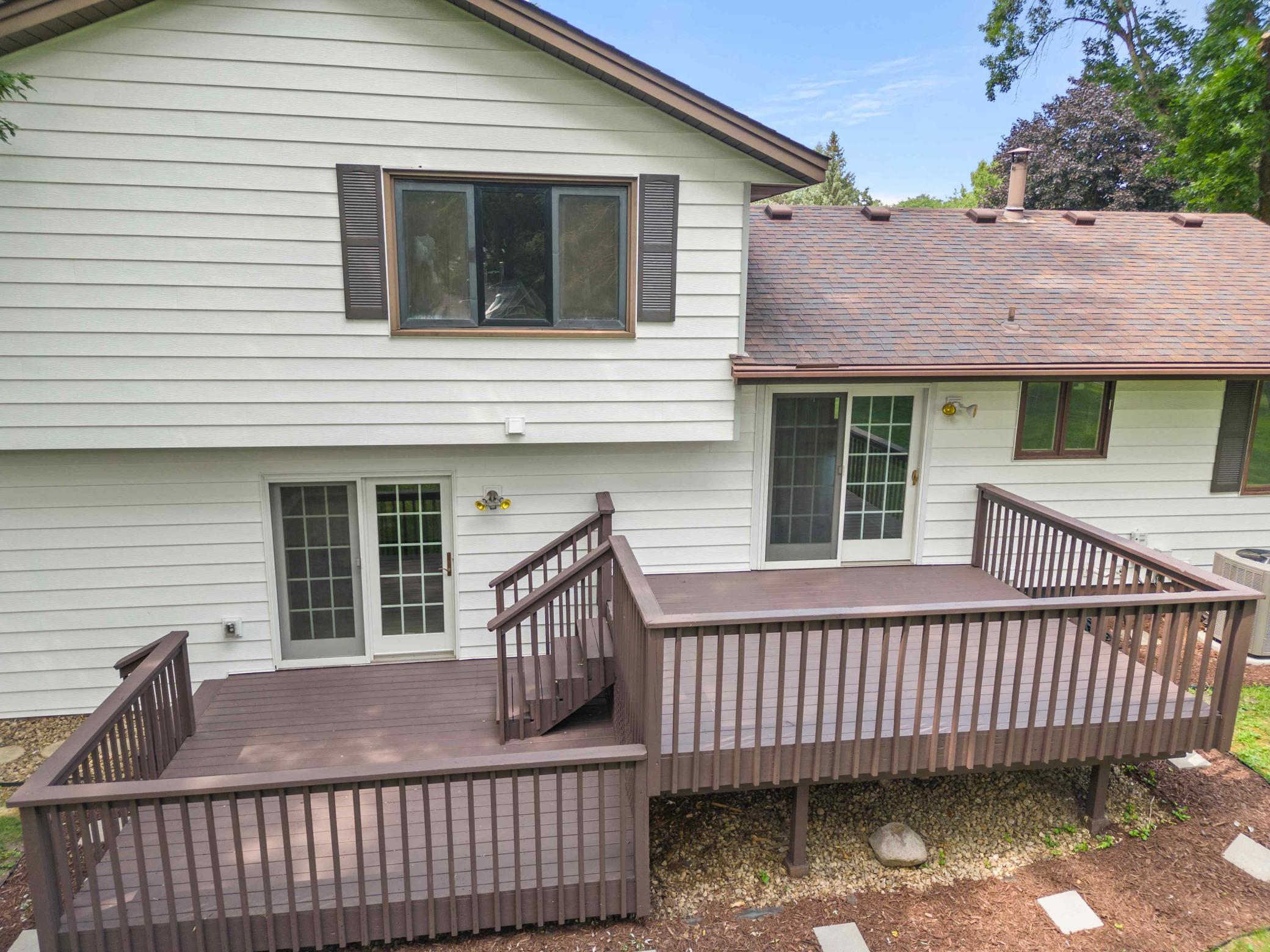 Two-tier deck expands the living space outdoors and offers multiple areas for dining, entertaining or relaxing