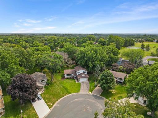 Tucked into an established neighborhood surrounded by mature trees and green space