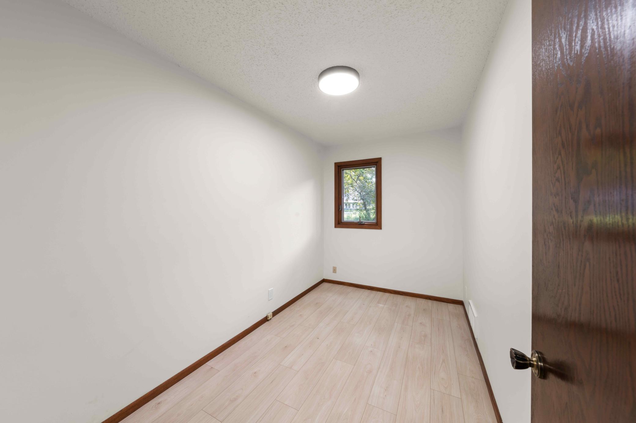 Versatile main-level flex room ideal for a home office, study, hobby space or quiet retreat