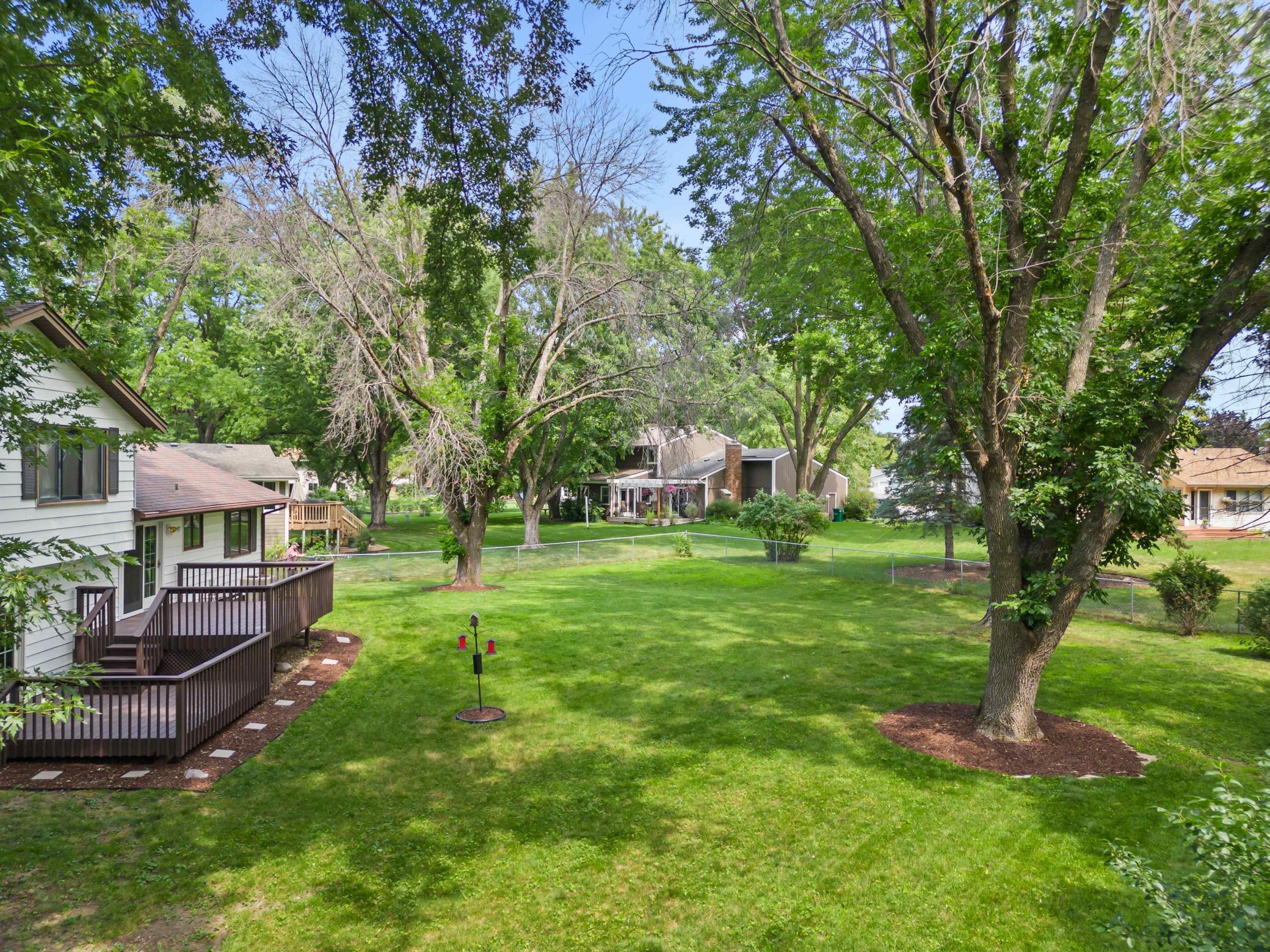 Spacious backyard and two-tier deck create a wonderful setting for relaxing, entertaining and outdoor living