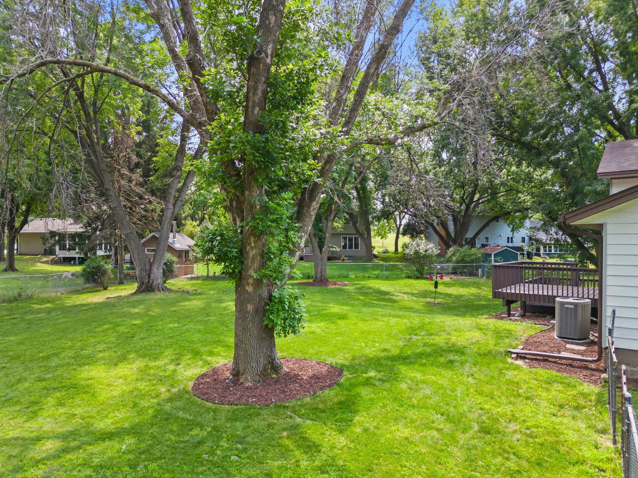 A peaceful, tree-lined setting offering an impressive amount of usable yard space