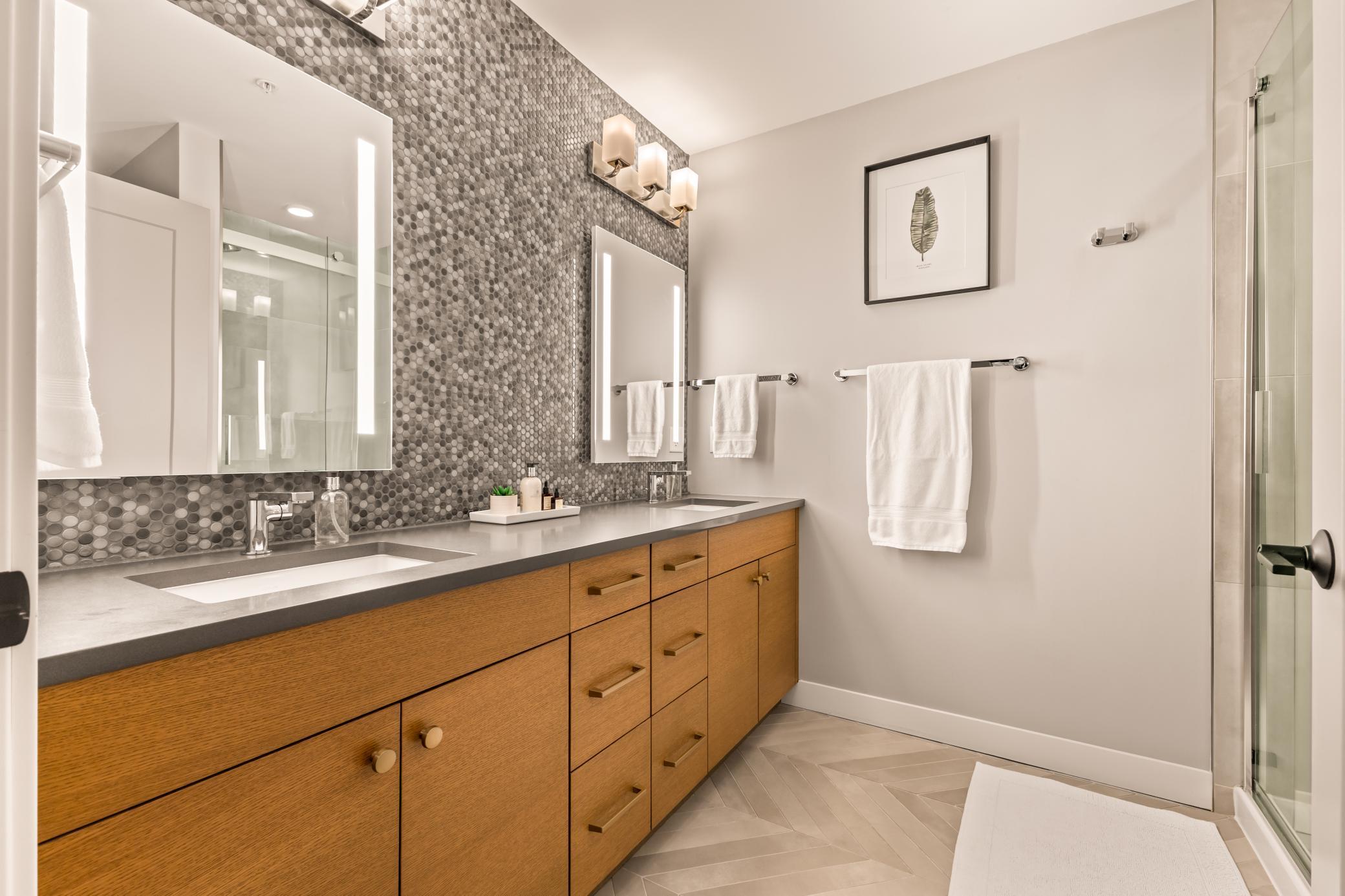 Primary Ensuite Spa-Like Bathroom with Dual Sink Vanity, Integrated Kohler Mirror Lighting + Tiled Walk-In Shower