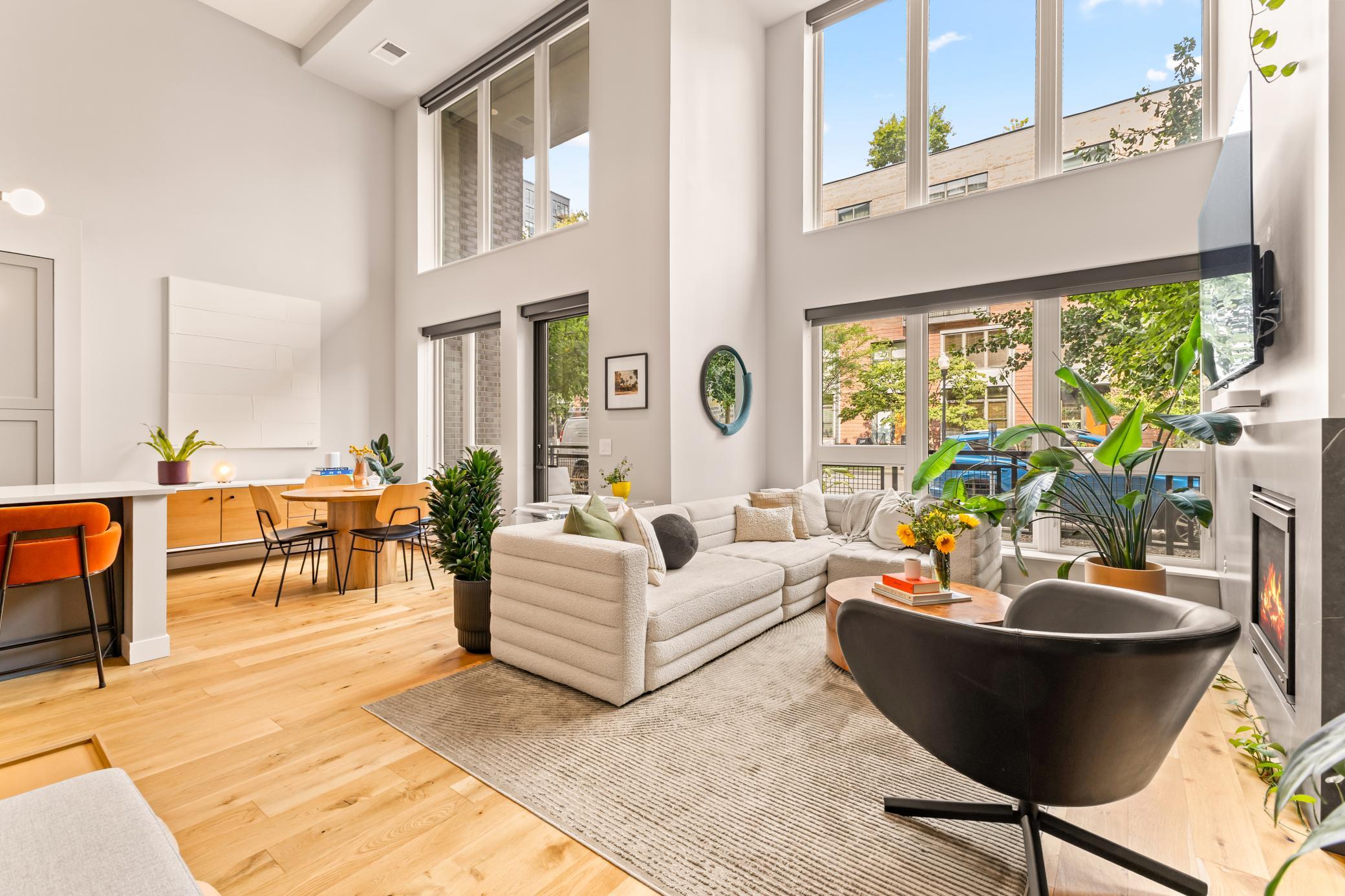 17' High Flat Ceilings with Two Great Walls of Trimless Windows for Ample Natural Light + Motorized Shades