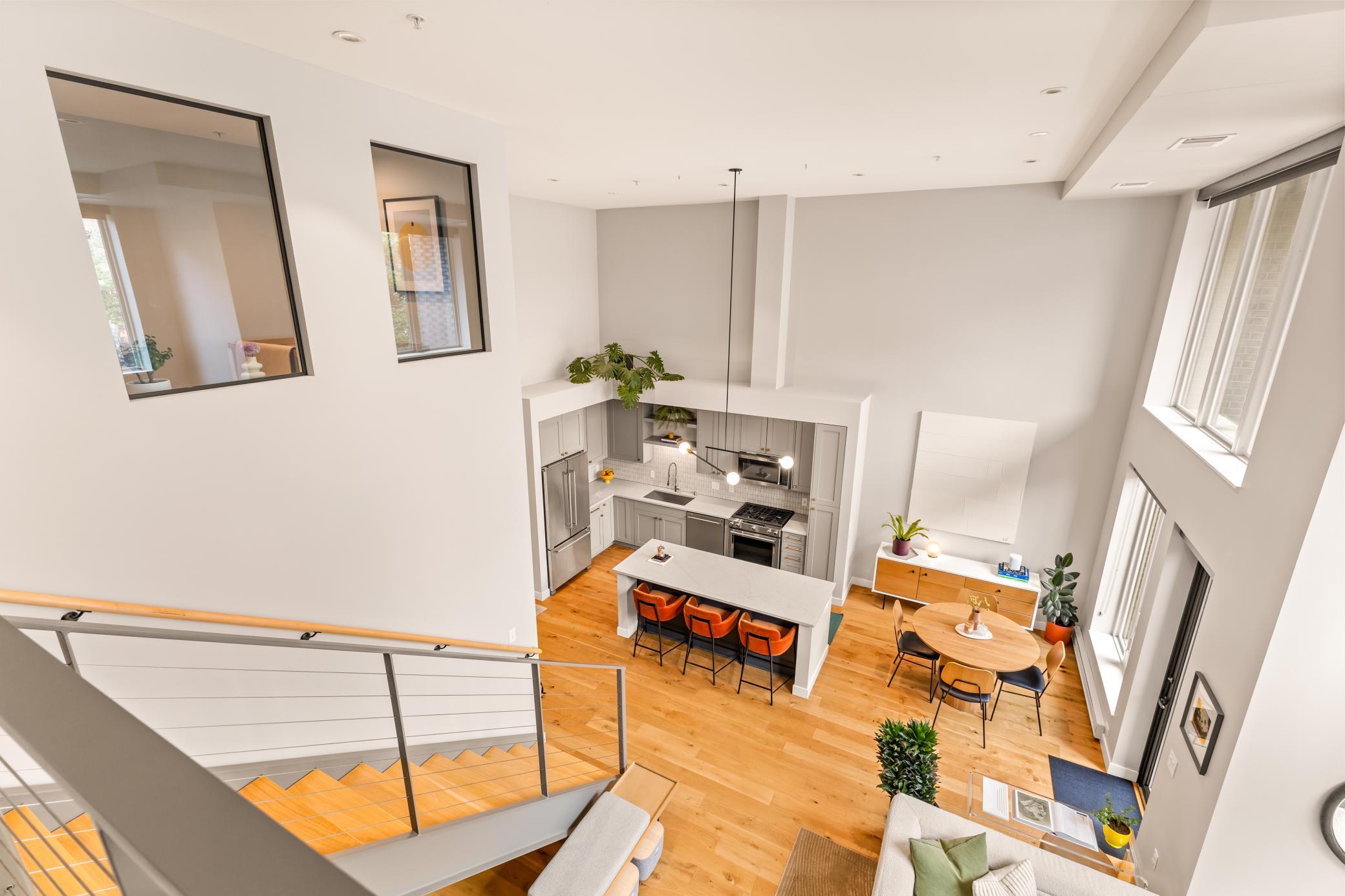 Loft Views of the Modern Living Space Below and Note the Transom Windows for the Flex Room that Allows Ample Natural Light to Flow Through