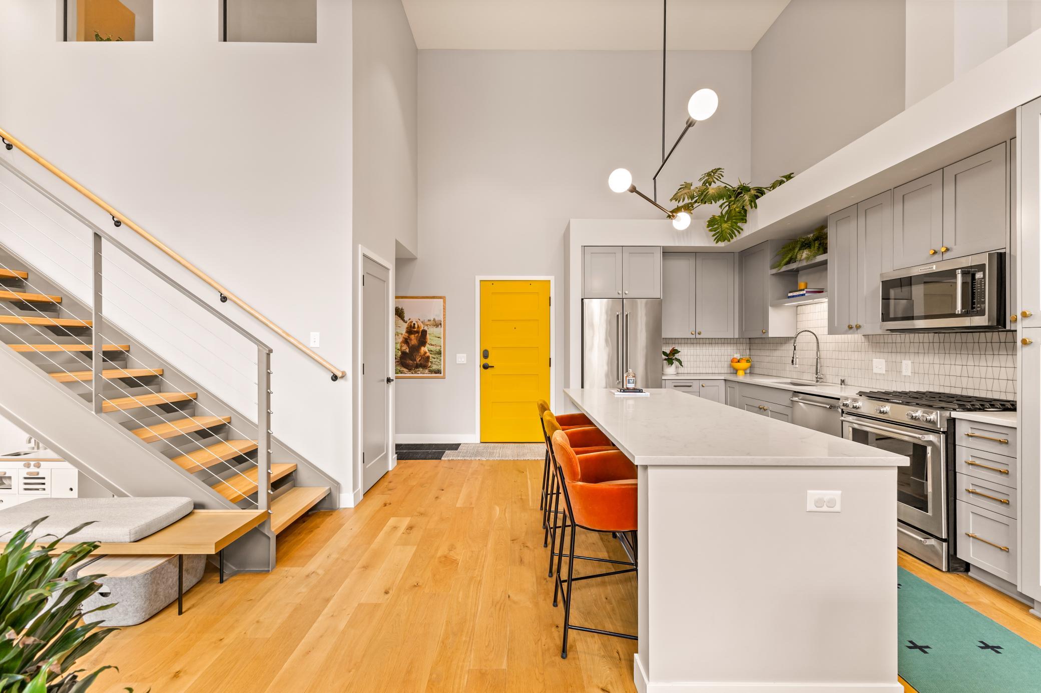 Dramatic Ceilings, Hardwood Flooring, Custom Cabinetry