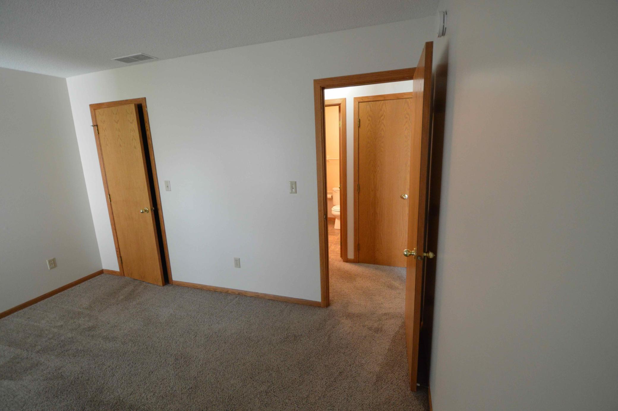 Primary bedroom access to bath/laundry