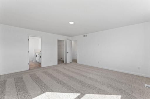 Plush wall-to-wall carpeting feels comfortable underfoot