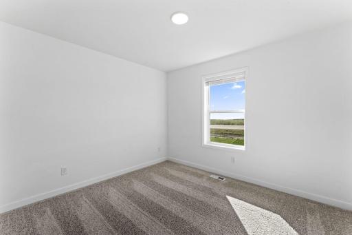 The secondary bedrooms offer comfort and privacy.