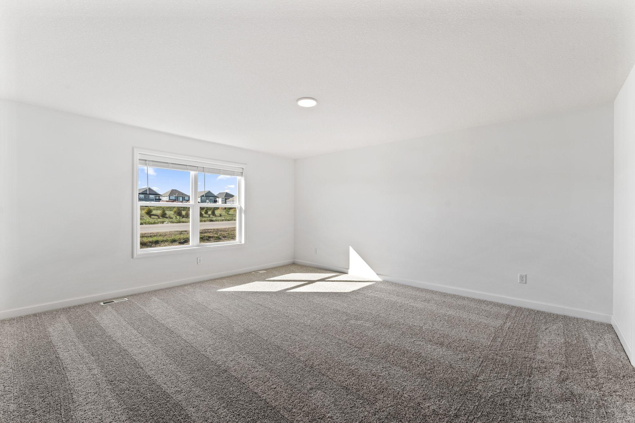 The owner’s suite is located upstairs, complete with a restful bedroom, an en-suite bathroom and a walk-in closet.