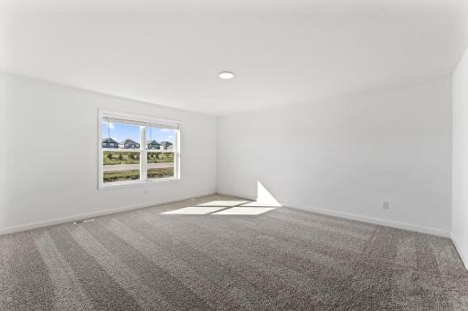 The owner’s suite is located upstairs, complete with a restful bedroom, an en-suite bathroom and a walk-in closet.