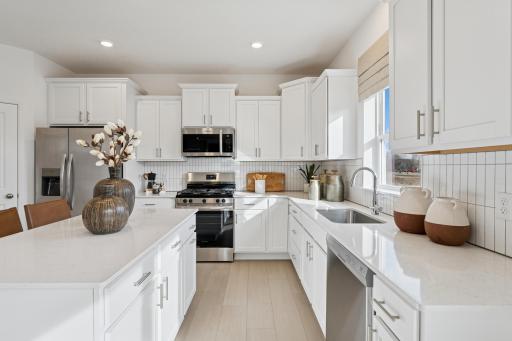 (Photo is of a decorated model, actual homes finishes will vary) Imagine cooking in this beautiful kitchen!