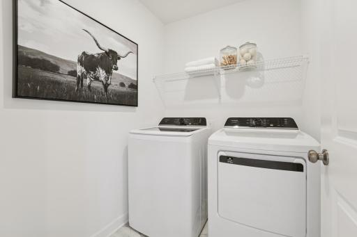 (Photo is of a decorated model, actual homes finishes will vary) Centrally located on the upper level, along with the four bedrooms, this laundry room is sure to provide the ultimate convenience.
