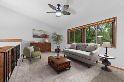 Virtually staged living room - the large windows give this end unit so much light.