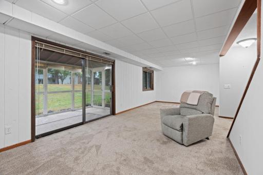 Large sliding glass doors take you out to the screened porch and large yard.