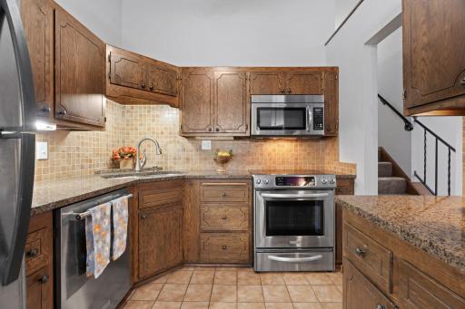 Kitchen remodelled with granite c-tops, newer stainless appliances.