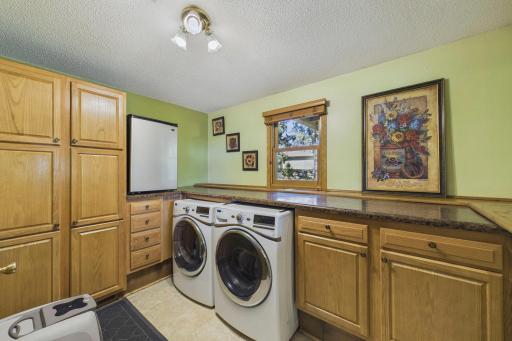 Laundry room with lots of storage and folding table