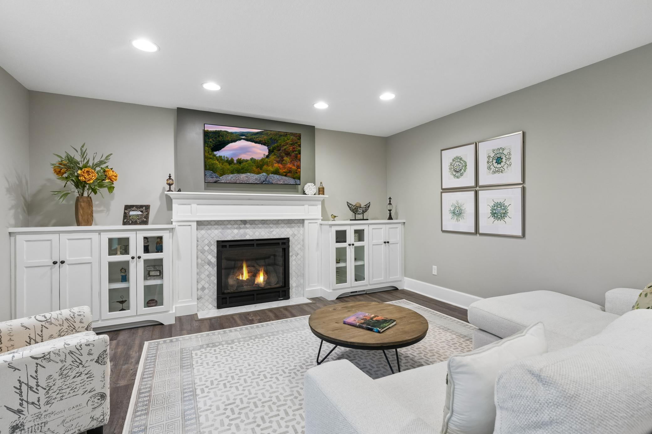The family room provides another comfortable gathering space, featuring a gas fireplace & built-in cabinetry.