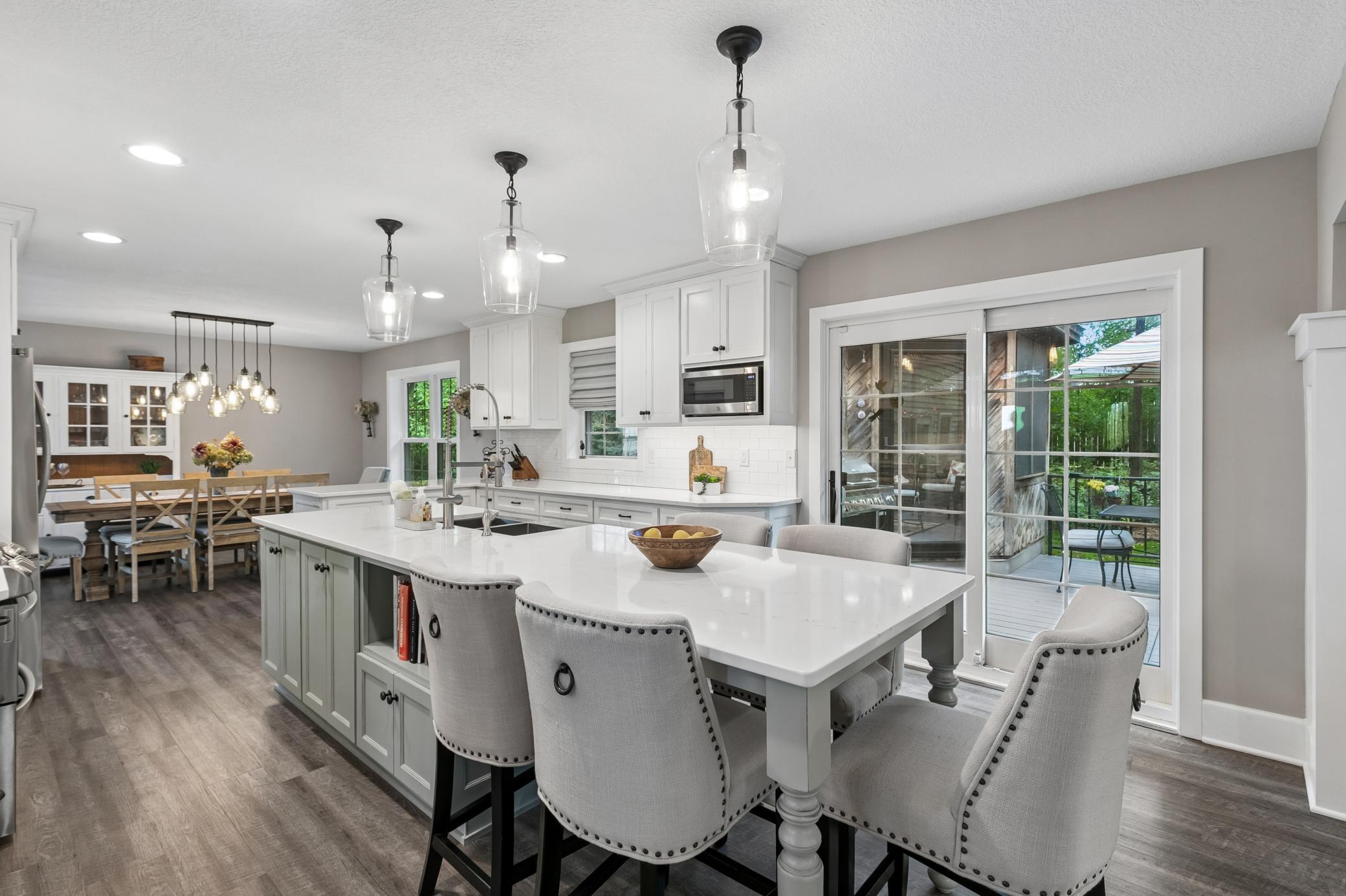 Generous center island with seating offers plenty of space for casual meals and conversation.