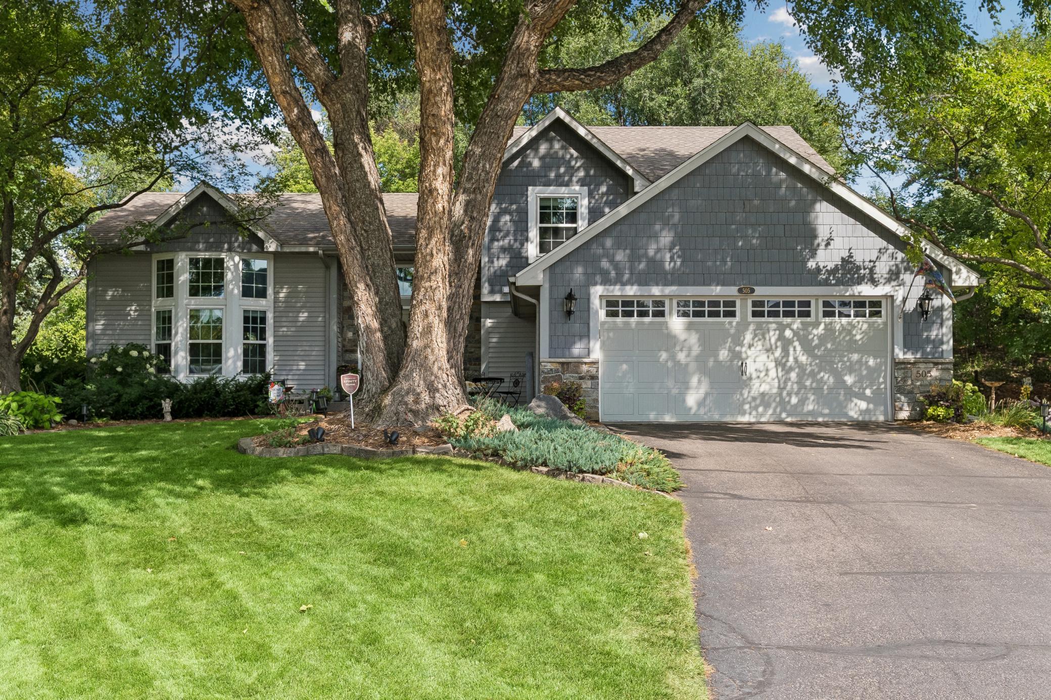 Set on a quiet cul-de-sac with beautiful curb appeal, this home welcomes you with established perennial gardens.