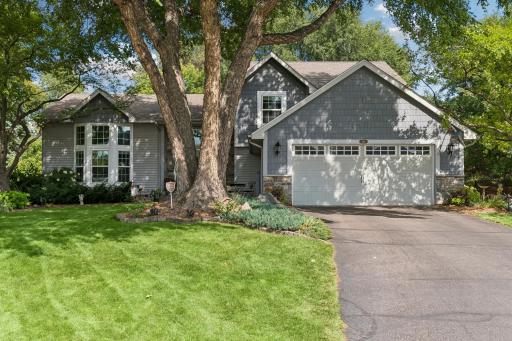 Set on a quiet cul-de-sac with beautiful curb appeal, this home welcomes you with established perennial gardens.