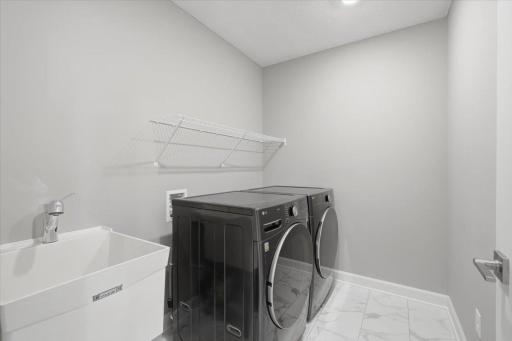 Laundry room conveniently located upstairs.