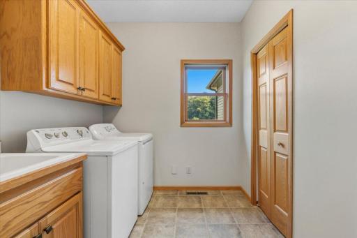 Main floor Laundry with Storage and sink.