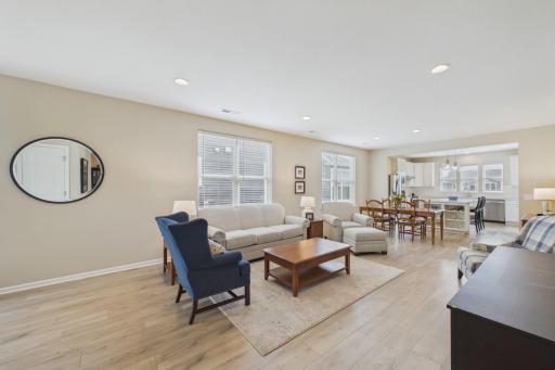 Open concept living room, tall ceilings, recessed LED lighting, upgraded flooring and upgraded window treatments.