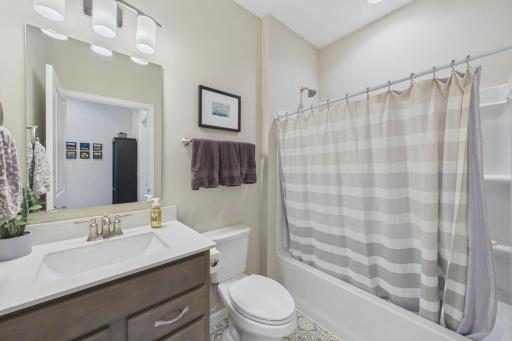 Full bathroom, solid surface counters, upgraded cabinetry and faucet.