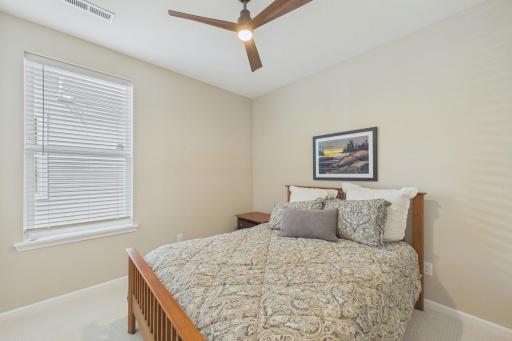 Second bedroom, carpeted, including ceiling fan