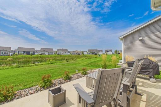Open spacious back patio (18x10) overlooking nice yard & pond.