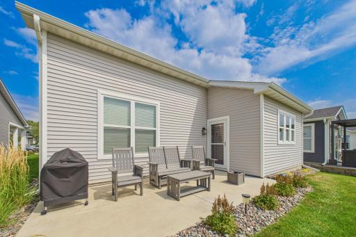 Open spacious back patio (18x10) overlooking nice yard & pond.