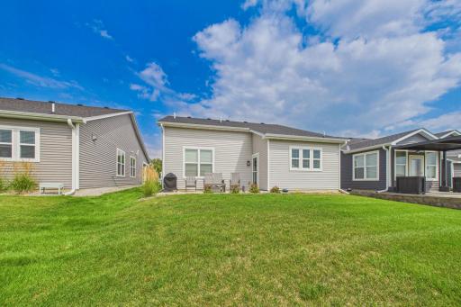 Open spacious back patio (18x10) overlooking nice yard & pond.