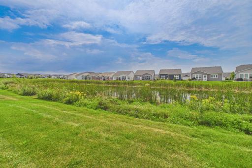 Large back yard including pond with cat tails & nature. Home does not directly back up to other properties.
