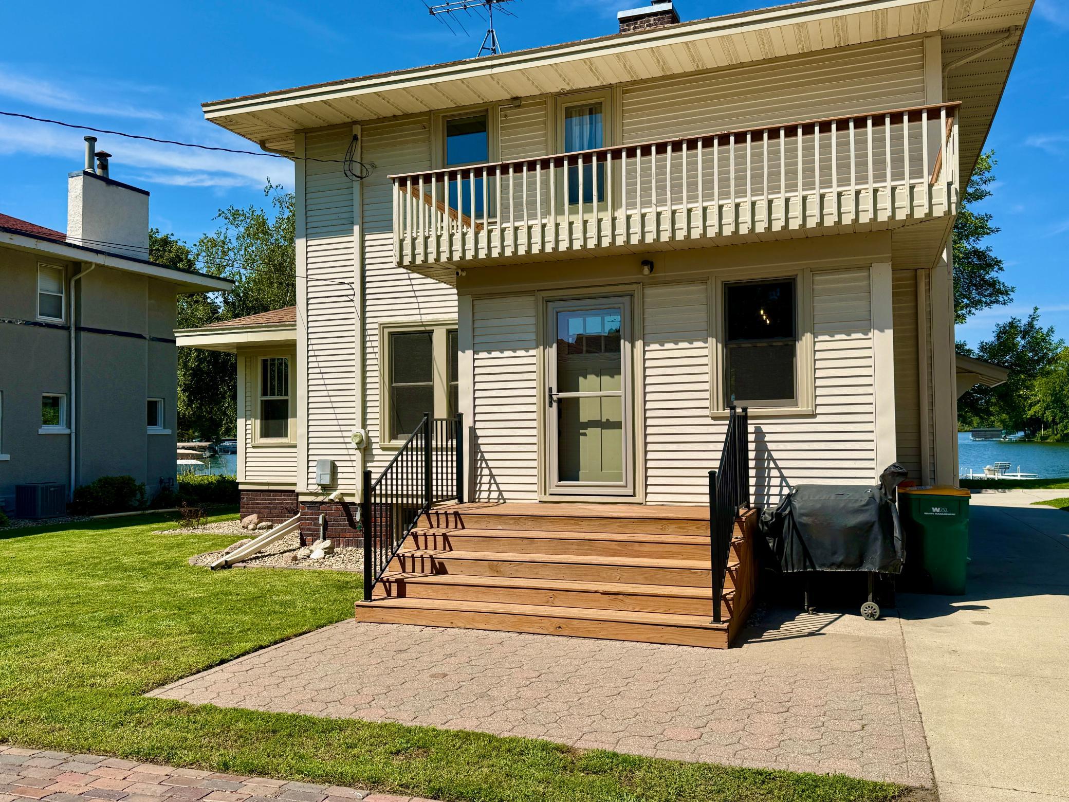 Rear with Pavers and upper balcony