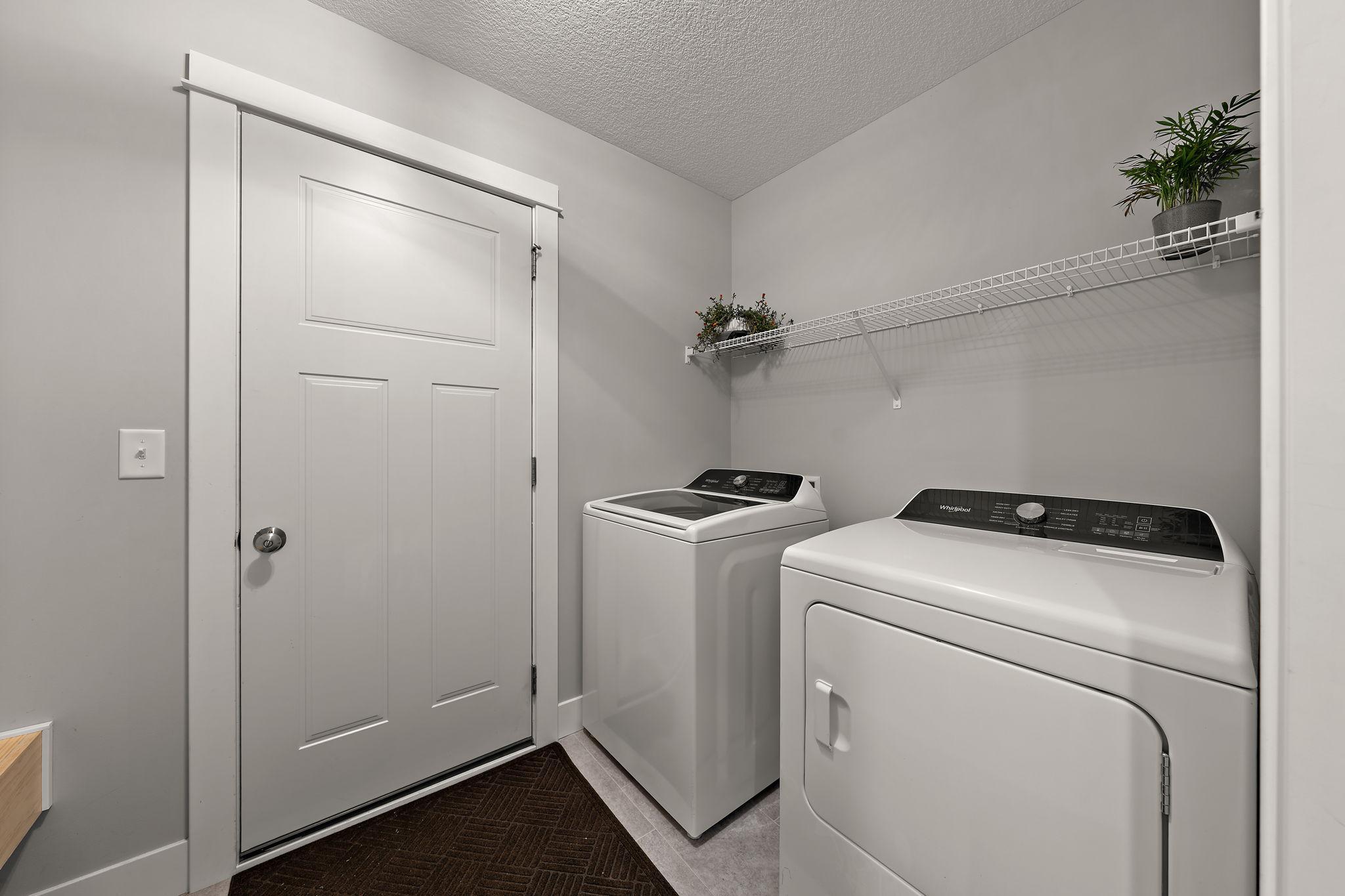 The laundry room is on the main floor level for convenience and the washer and dryer were new October 2024.