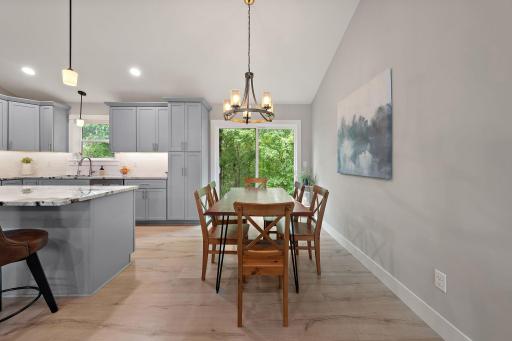 The dining area is right off of the kitchen and a patio door faces the back lot and offers an opportunity for a deck to be built if a new homeowner desires one.