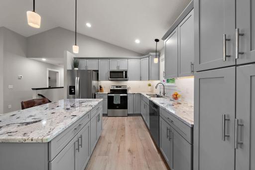 The island counter has additional storage drawers and cabinets.