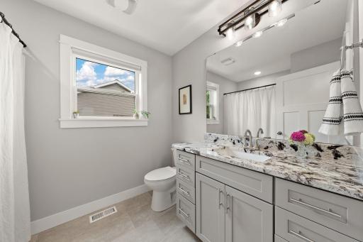 The main floor full bathroom located right off the hallway and living room.