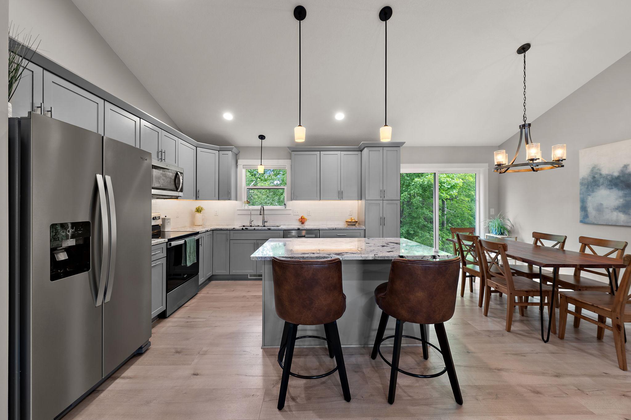 The window above the kitchen sink offers a backyard view and the current owners installed a reverse osmosis water system which is leased.