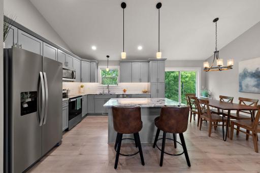 The window above the kitchen sink offers a backyard view and the current owners installed a reverse osmosis water system which is leased.