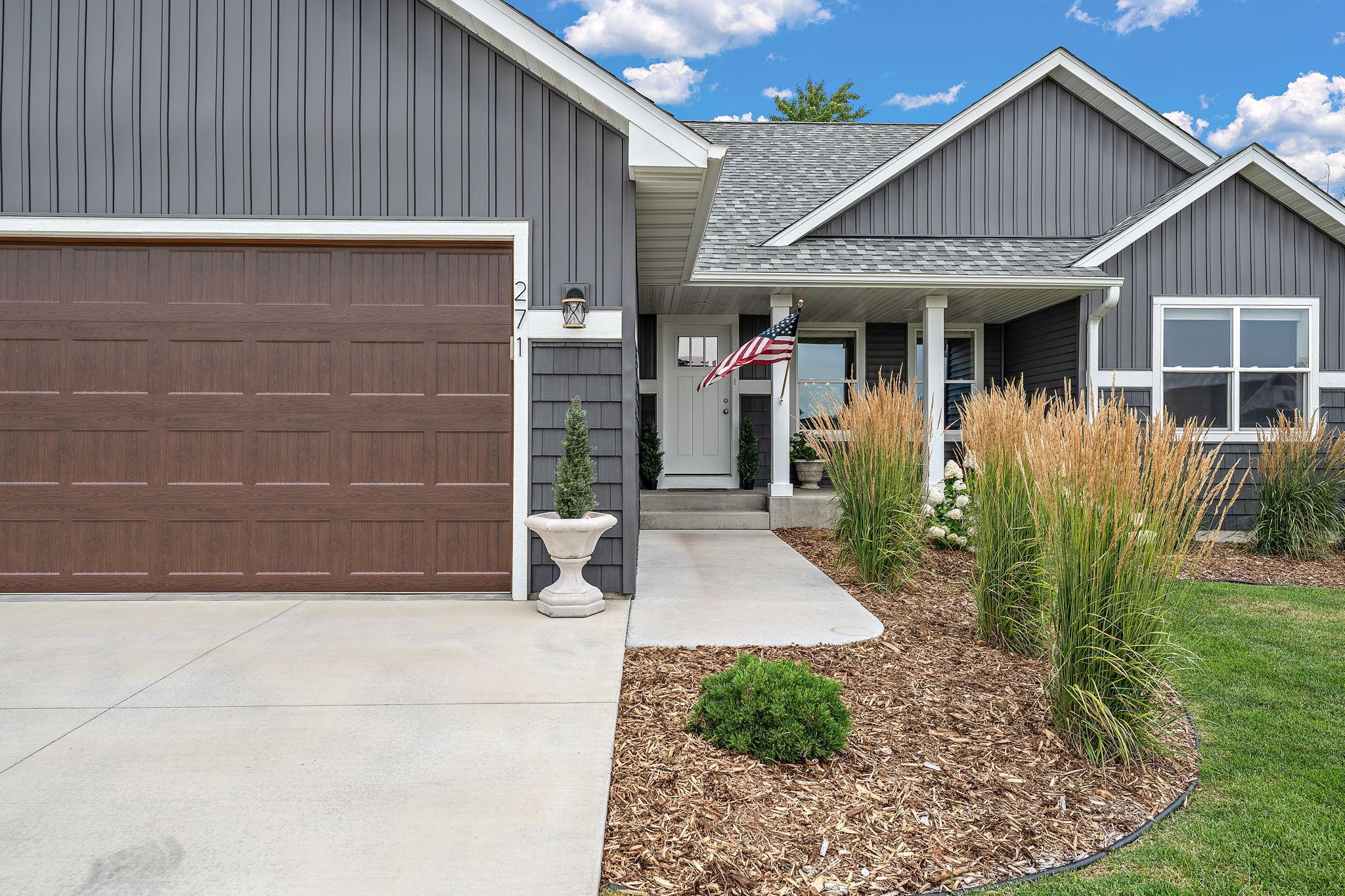 The front of the home features a stoop perfect for porch sitting while waiting for guests to pull in the drive.