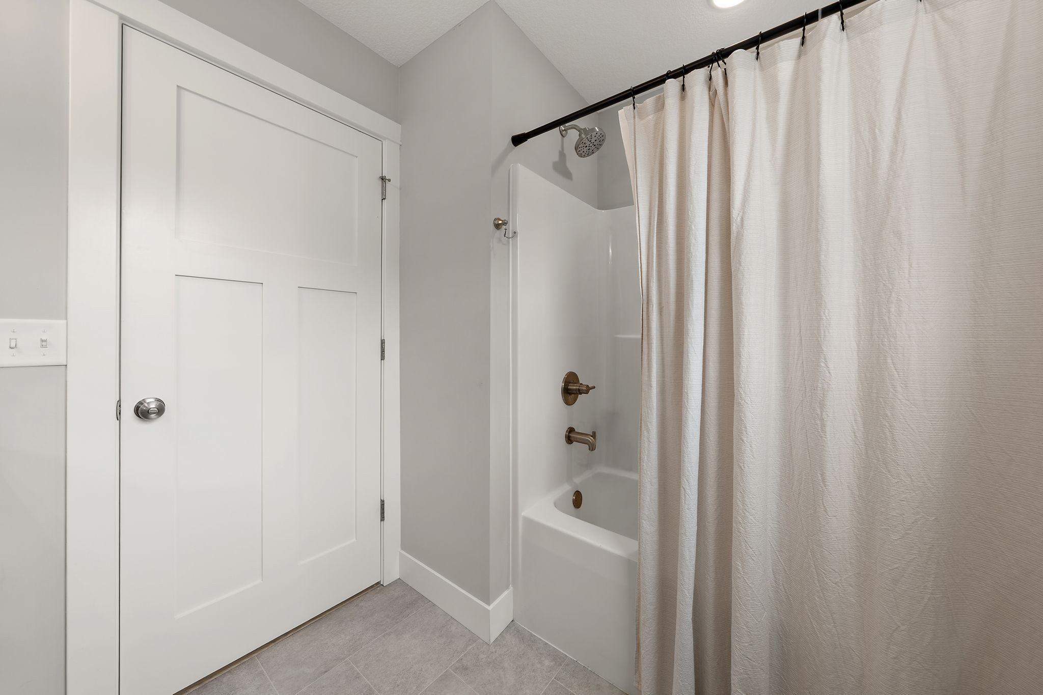 The main floor full bathroom is a tub/shower combo.