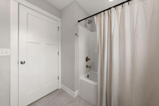 The main floor full bathroom is a tub/shower combo.