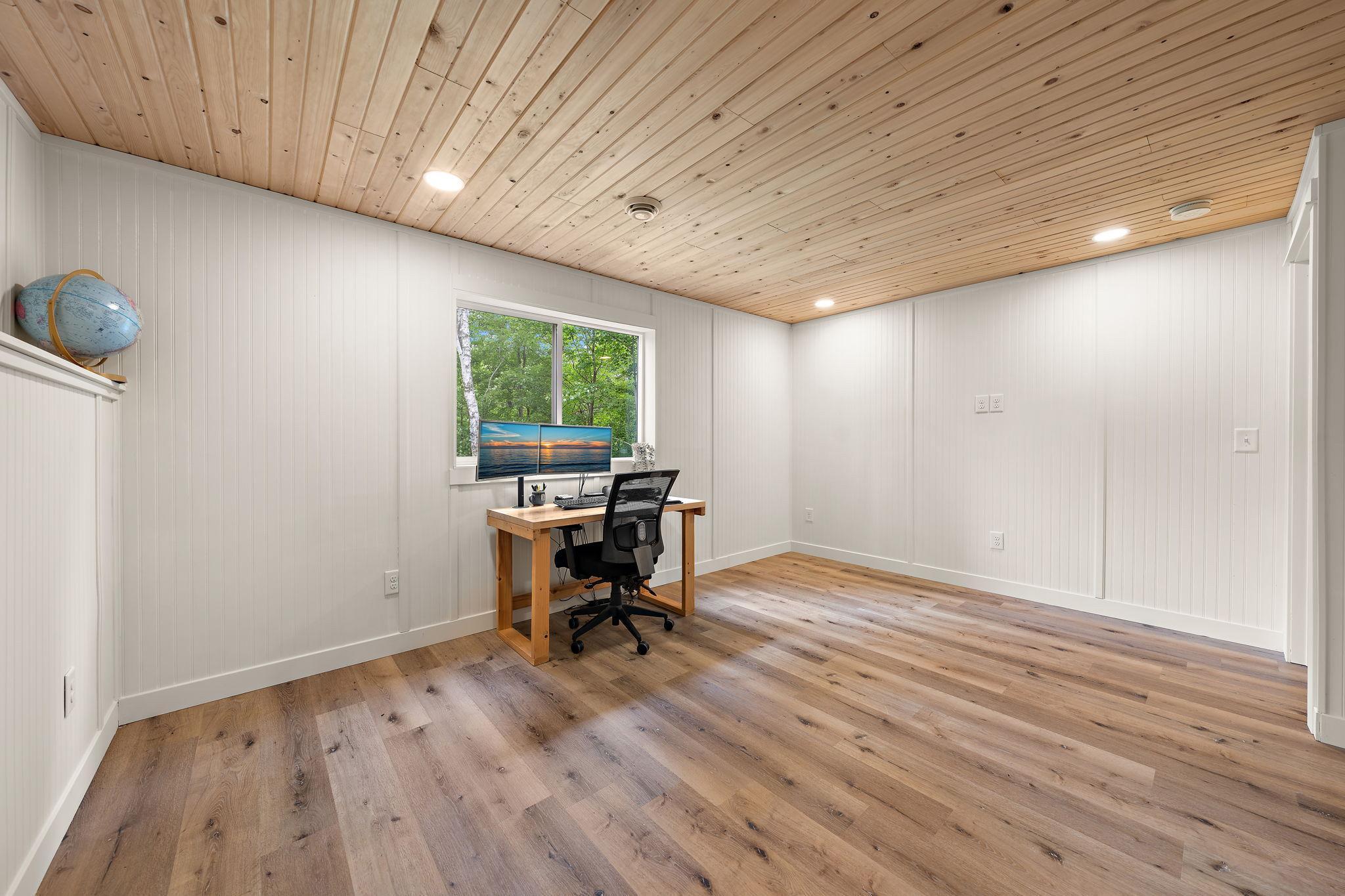 The fourth bedroom is spacious and has a window facing the back yard.