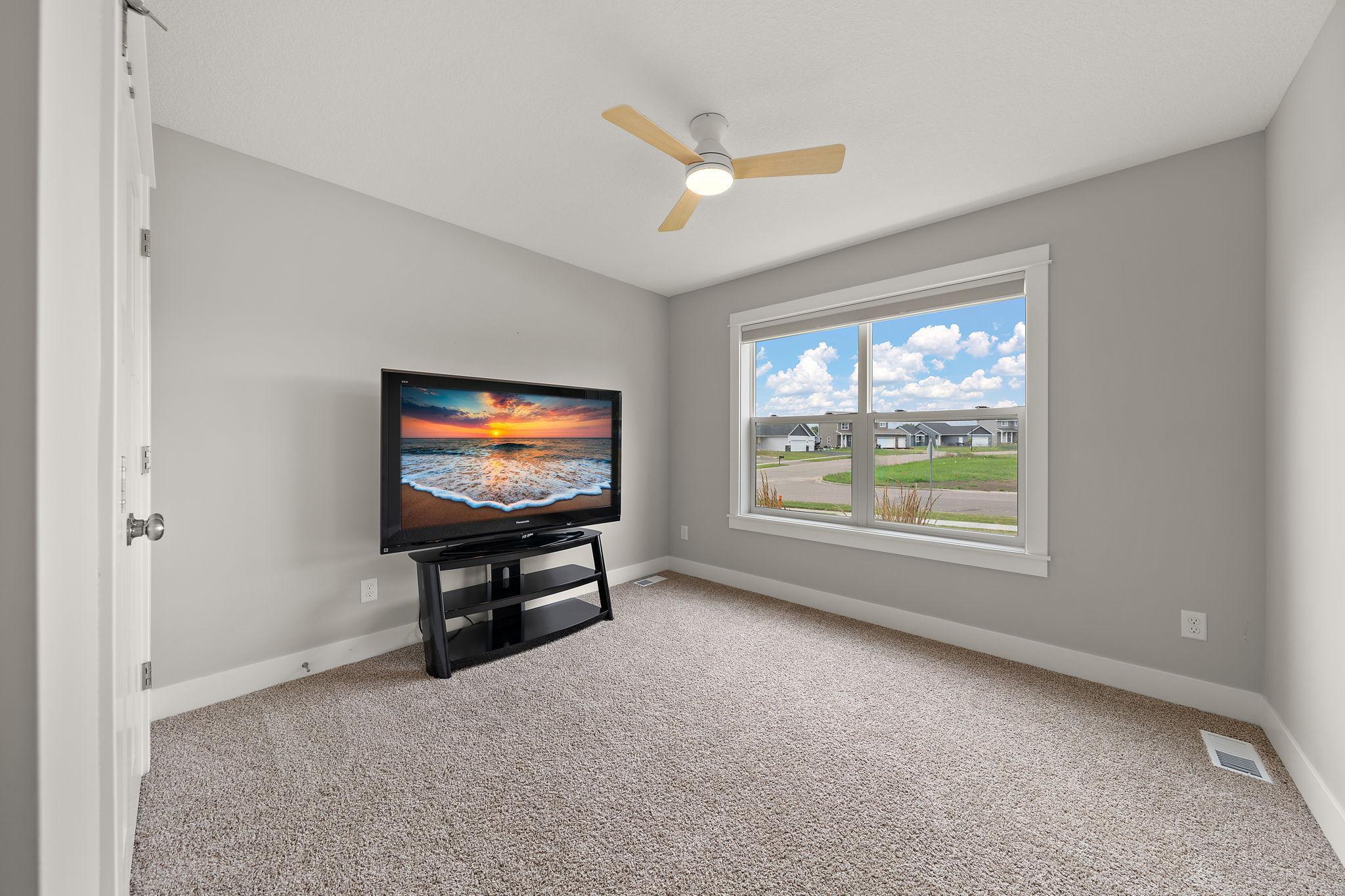 The second main floor bedroom has a street view and is carpeted.