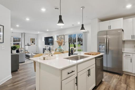(Photo of decorated model, actual home's finishes vary) Thoughtfully-designed with a combination of functionality and modern design, this kitchen space is sure to impress.