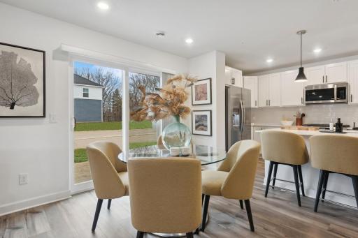 (Photo of a decorated model, actual homes finishes will vary) Ample space for a dining room table!