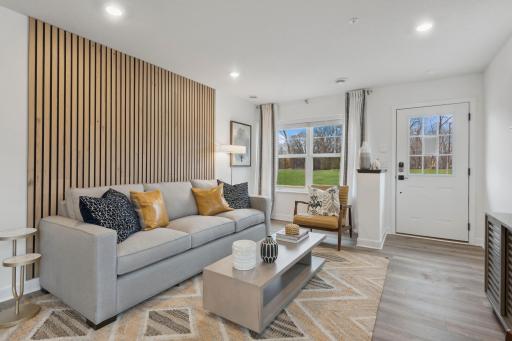 (Photo of decorated model, actual home's finishes vary) Notice the stunning natural light pouring into the family room.