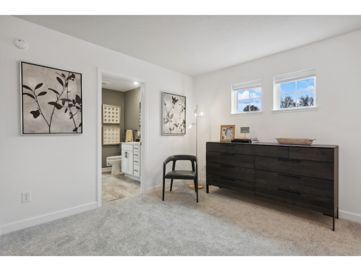 (Photo of a decorated model, actual homes finishes will vary) Spacious, imaginative and modern would best describe the owner's suite.